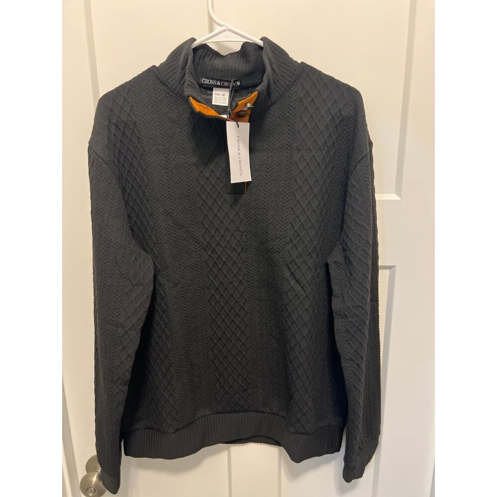 Cross & Crown brand quilted quarter-button pullover in black.